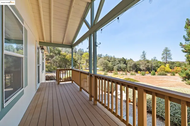 a view of a swimming pool with a bench in the background