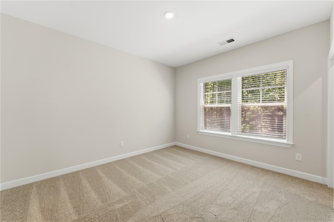 701 Weathered Oak Way Anderson, SC 29621 - Photo 28 of 41 Bright, airy bedroom with ample natural light, perfect for peaceful repose and daily living.