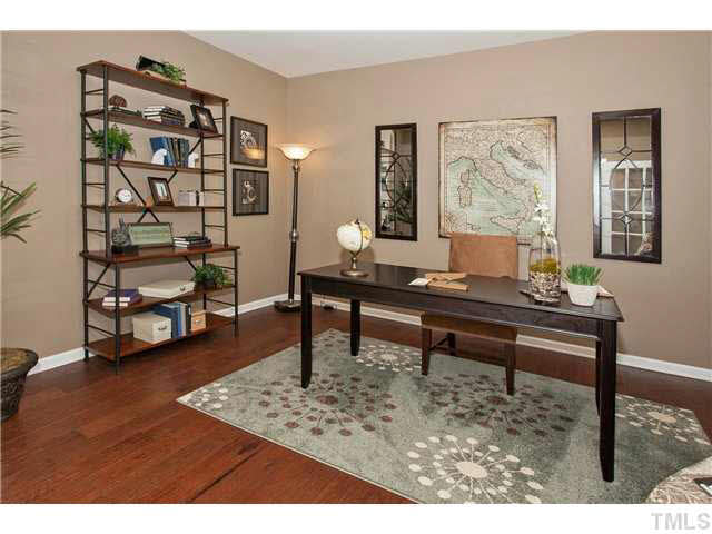 2707 Shepherd Valley Street Raleigh, NC 27610 - Photo 3 of 20 a living room with furniture and a wooden floor