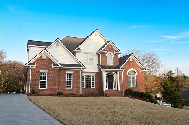 front view of a house with a yard