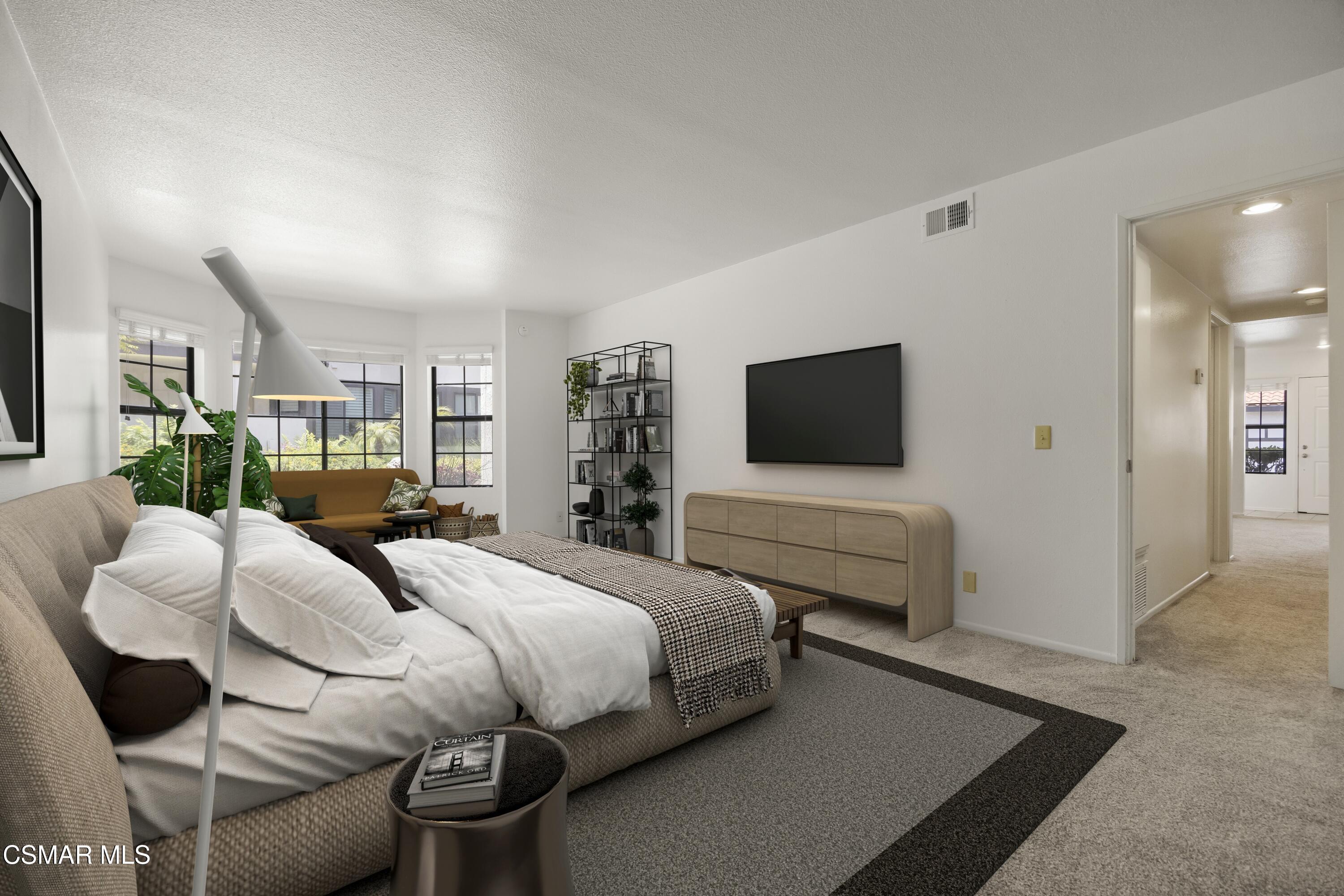 1923 Majorca Drive Oxnard, CA 93035 - Photo 22 of 34 a bedroom with a bed and large windows