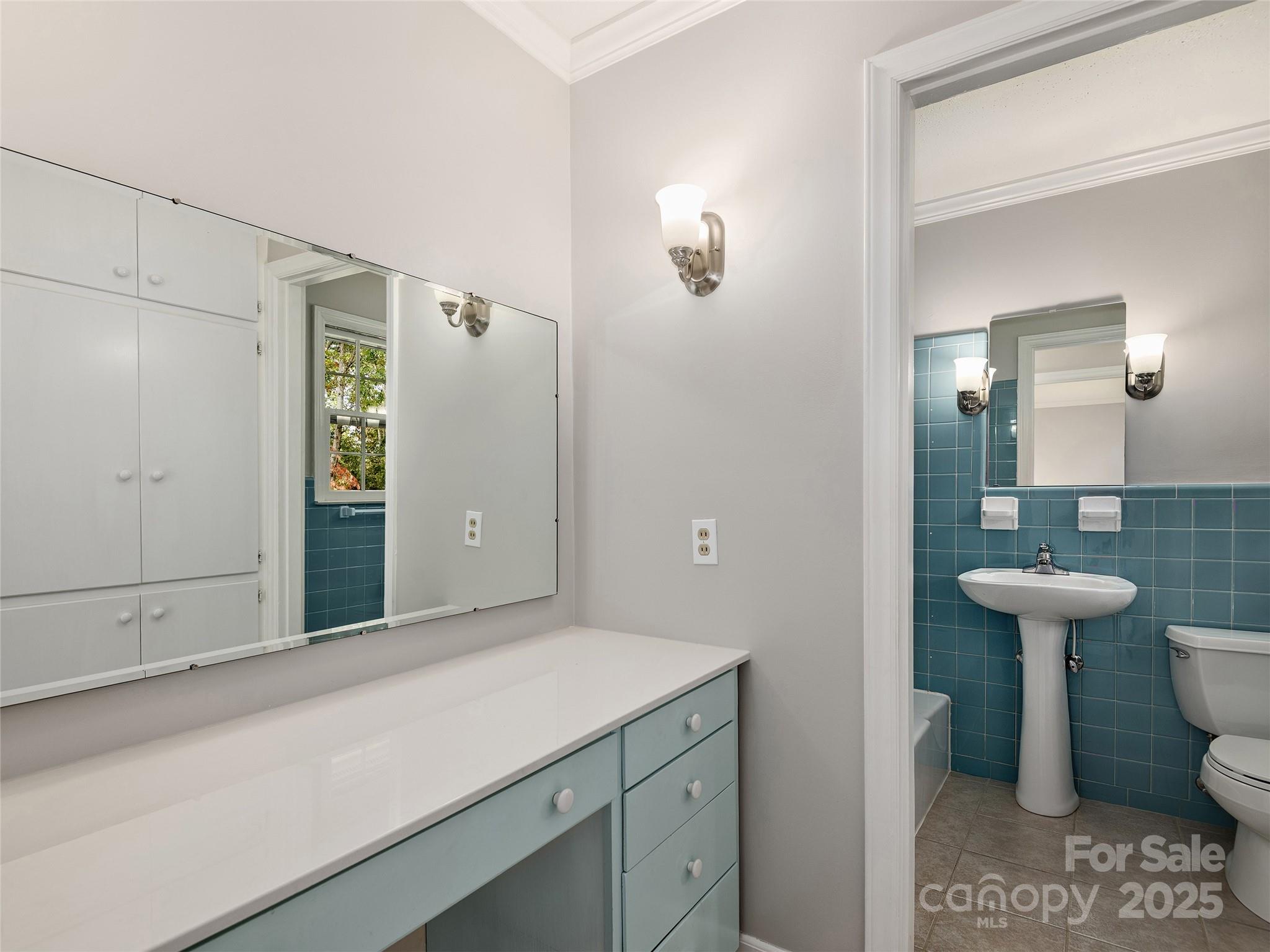 7 East Fox Chase Road Asheville, NC 28804 - Photo 16 of 30 a bathroom with a sink and a mirror