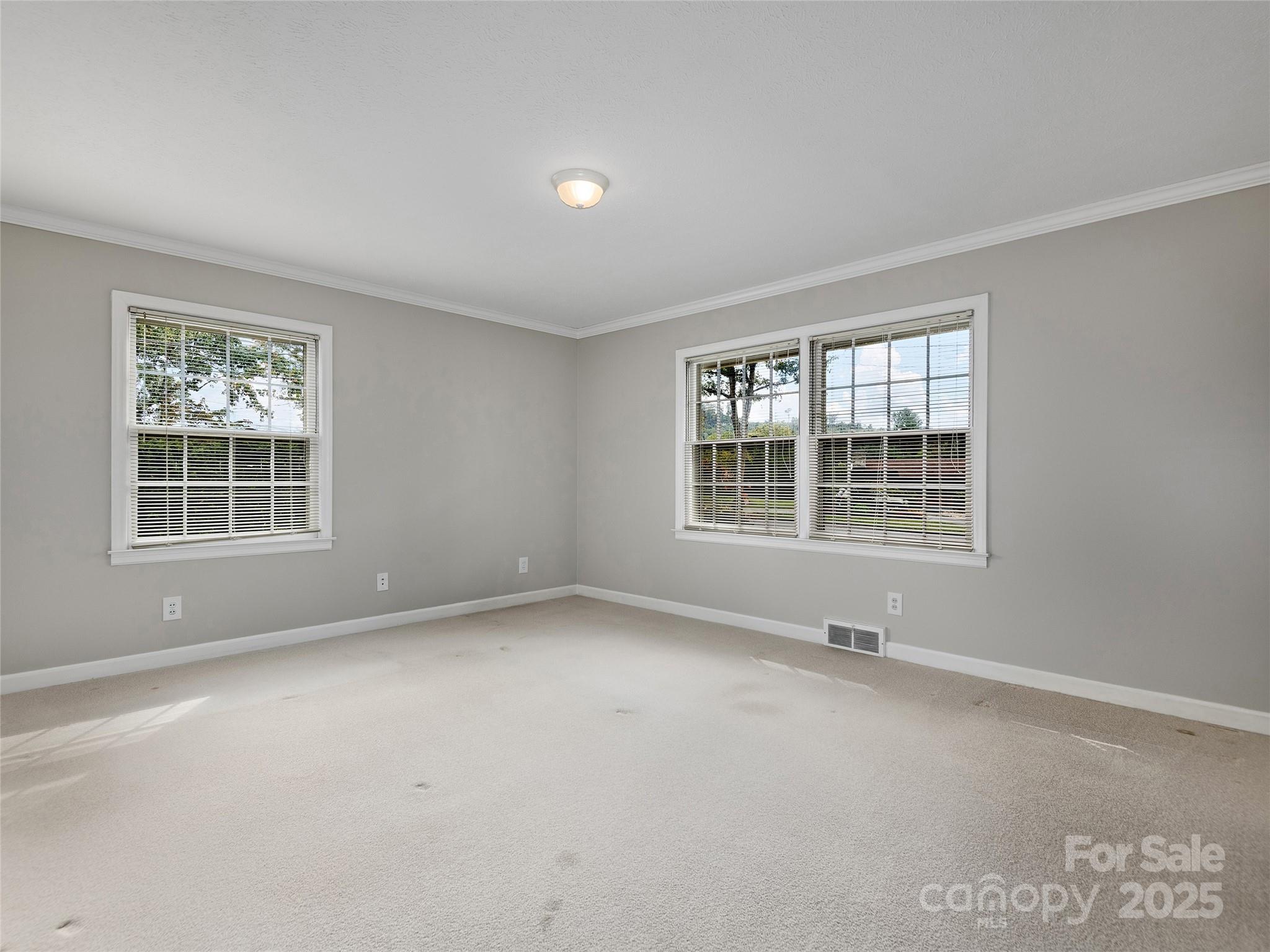 7 East Fox Chase Road Asheville, NC 28804 - Photo 19 of 30 an empty room with windows