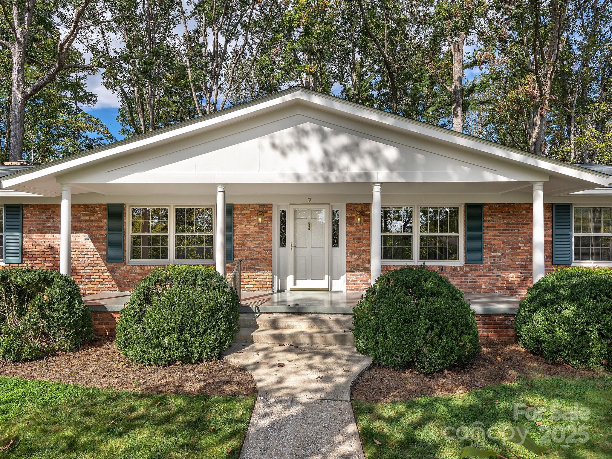 7 East Fox Chase Road Asheville, NC 28804 - Photo 2 of 30 a front view of a house with garden