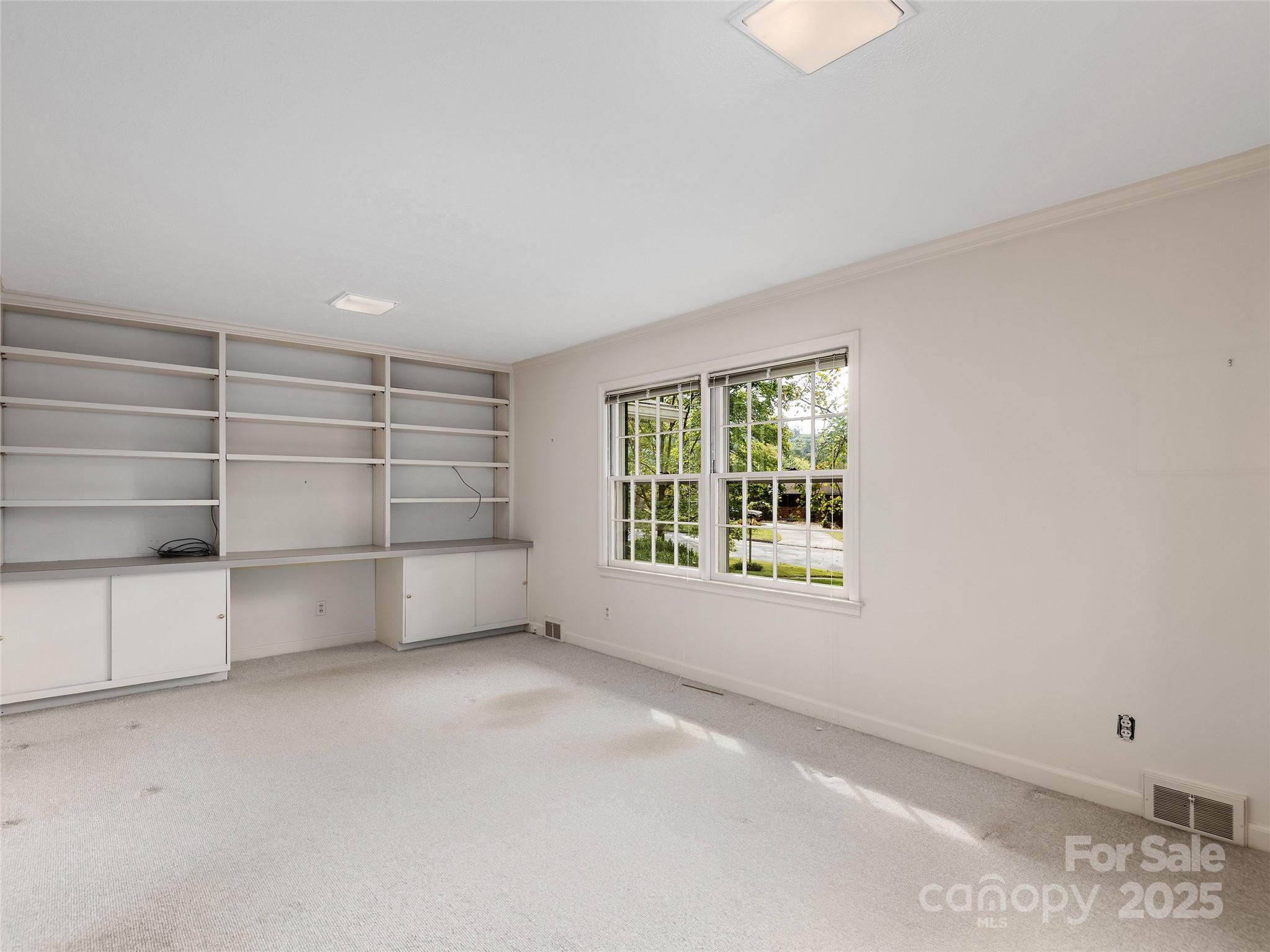 7 East Fox Chase Road Asheville, NC 28804 - Photo 21 of 30 a view of an empty room with a window