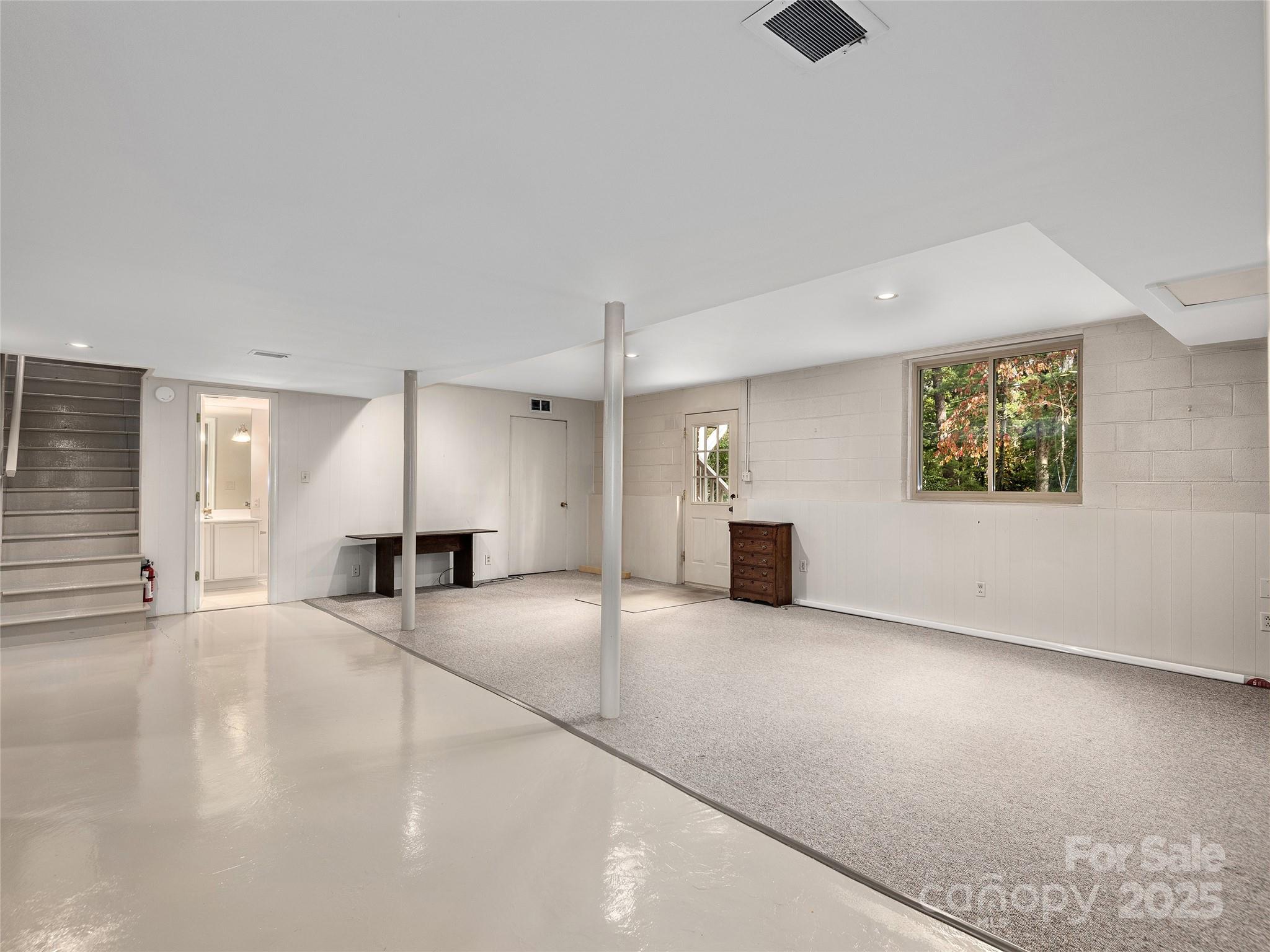 7 East Fox Chase Road Asheville, NC 28804 - Photo 23 of 30 an empty room with windows and couches