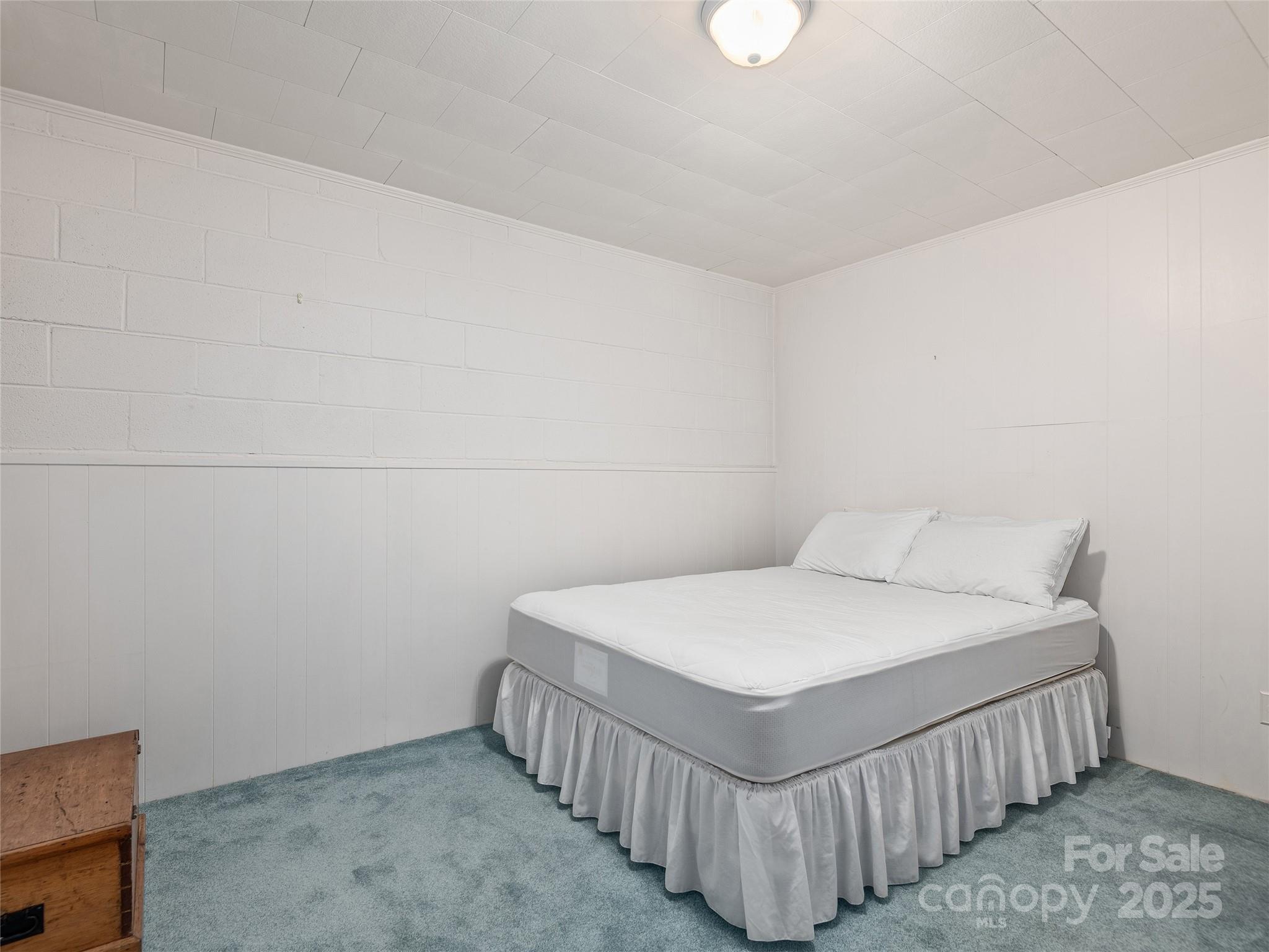 7 East Fox Chase Road Asheville, NC 28804 - Photo 25 of 30 a bedroom with a bed and a window