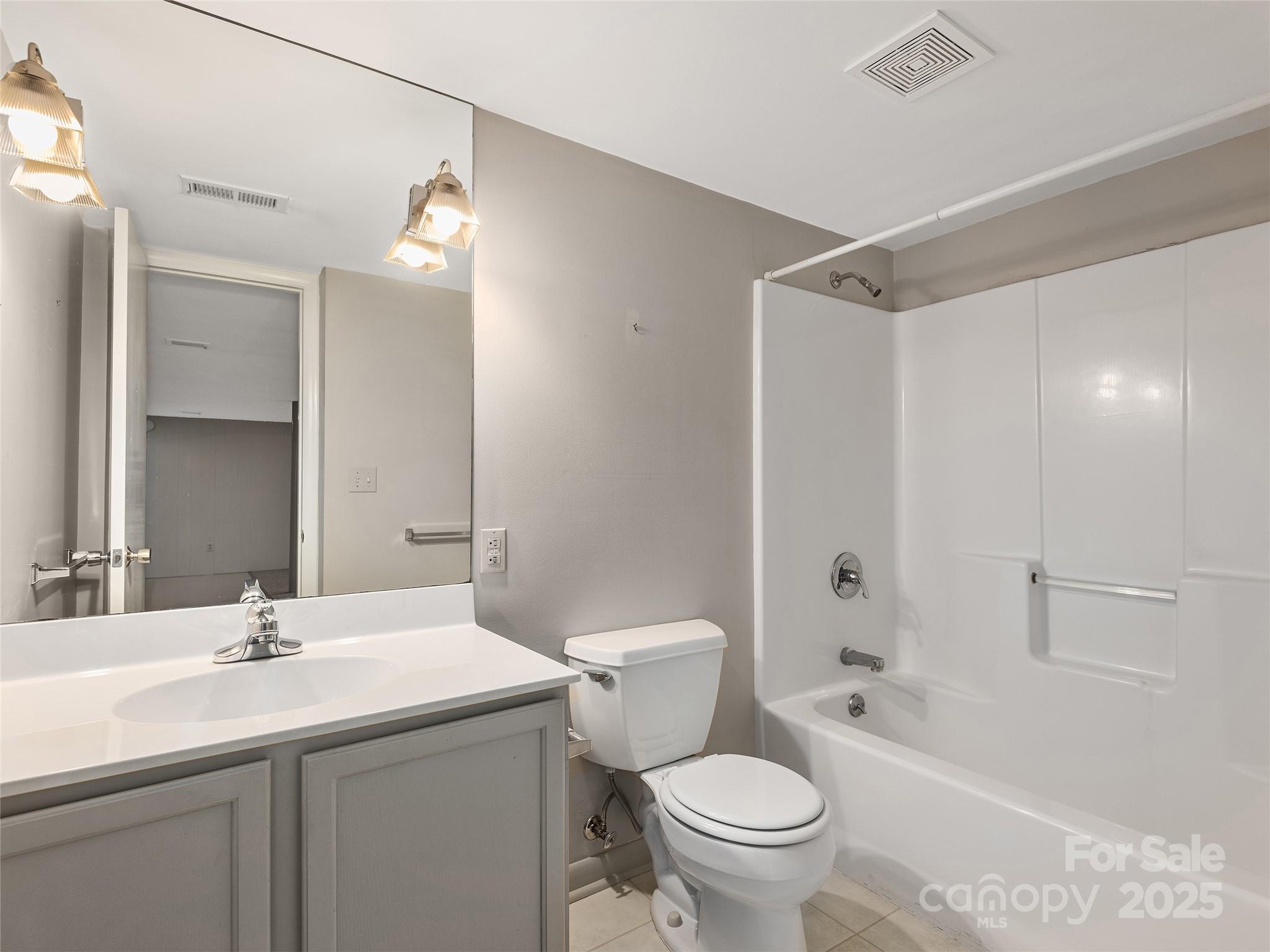 7 East Fox Chase Road Asheville, NC 28804 - Photo 26 of 30 a bathroom with a sink toilet and shower