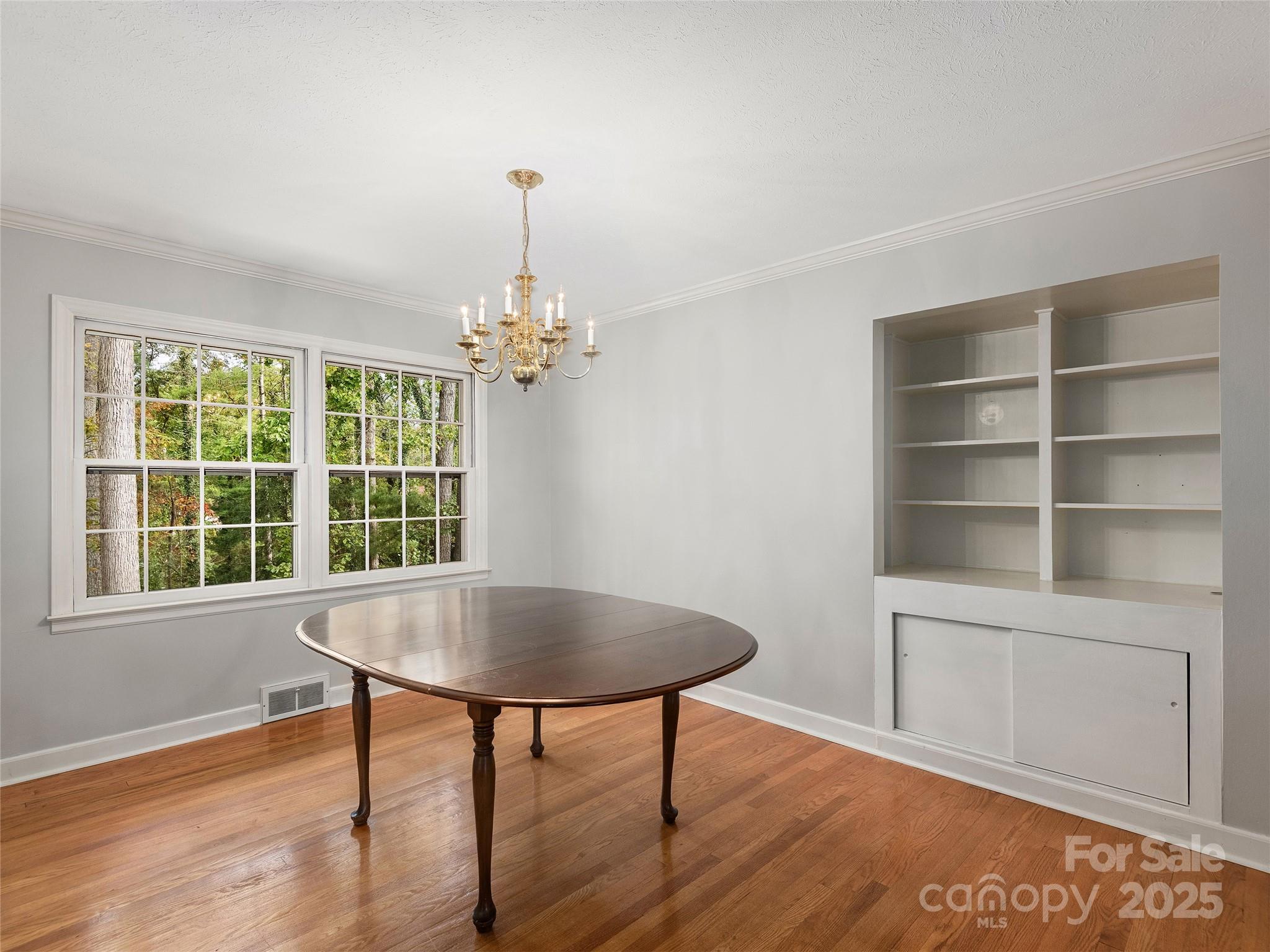 7 East Fox Chase Road Asheville, NC 28804 - Photo 7 of 30 a view of a room with furniture window and wooden floor