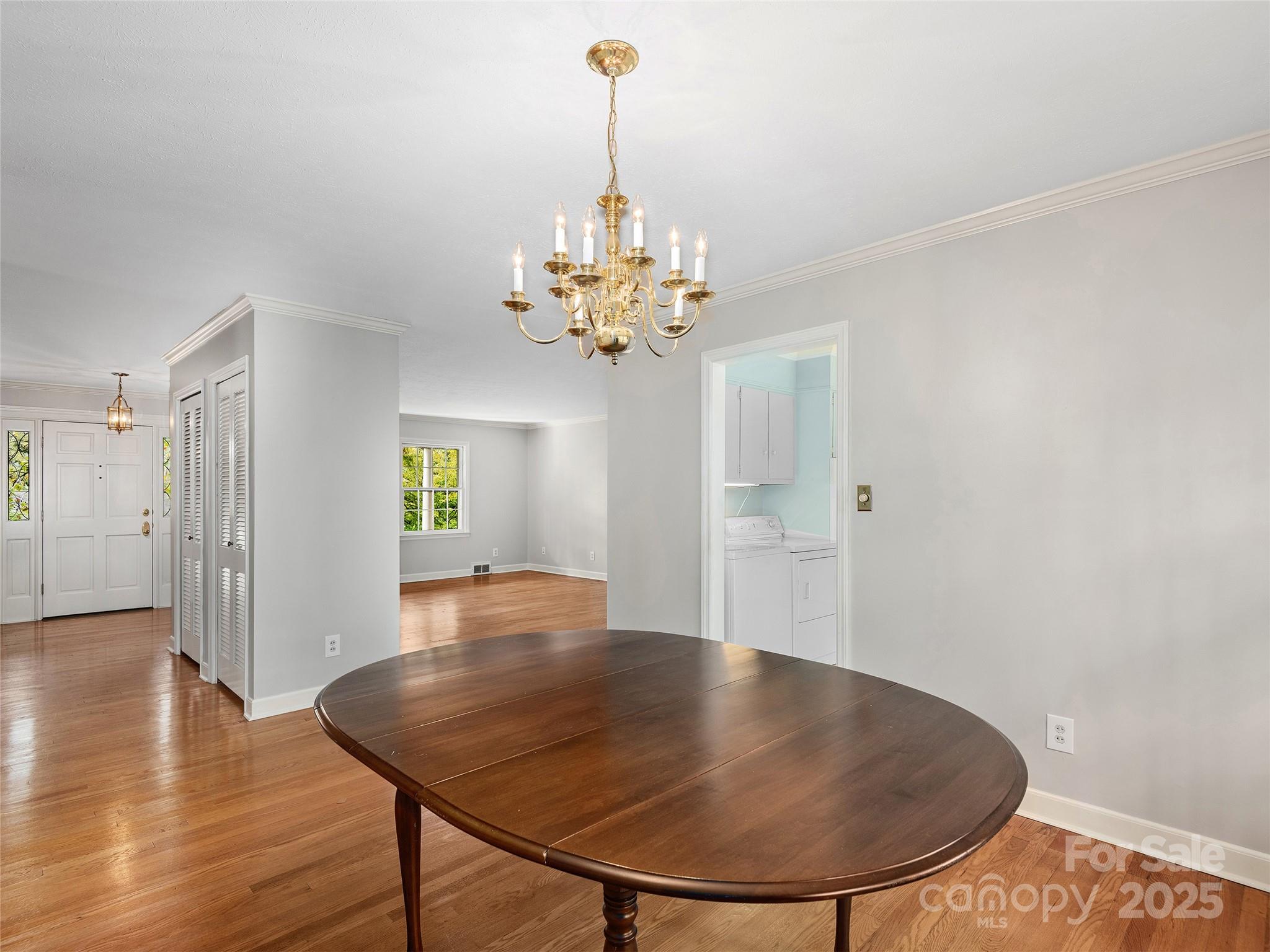 7 East Fox Chase Road Asheville, NC 28804 - Photo 8 of 30 a view of a dining room with furniture and wooden floor
