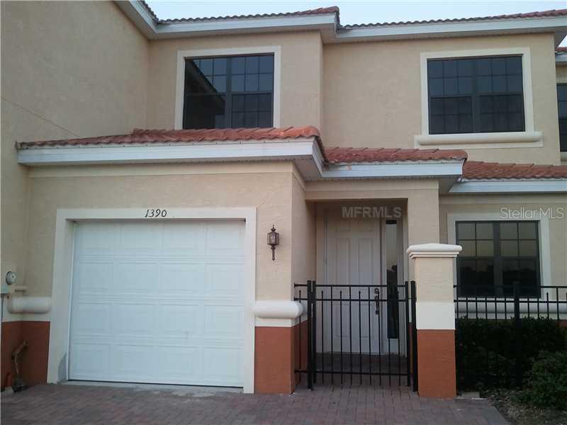 a view of a house with a door and a garage