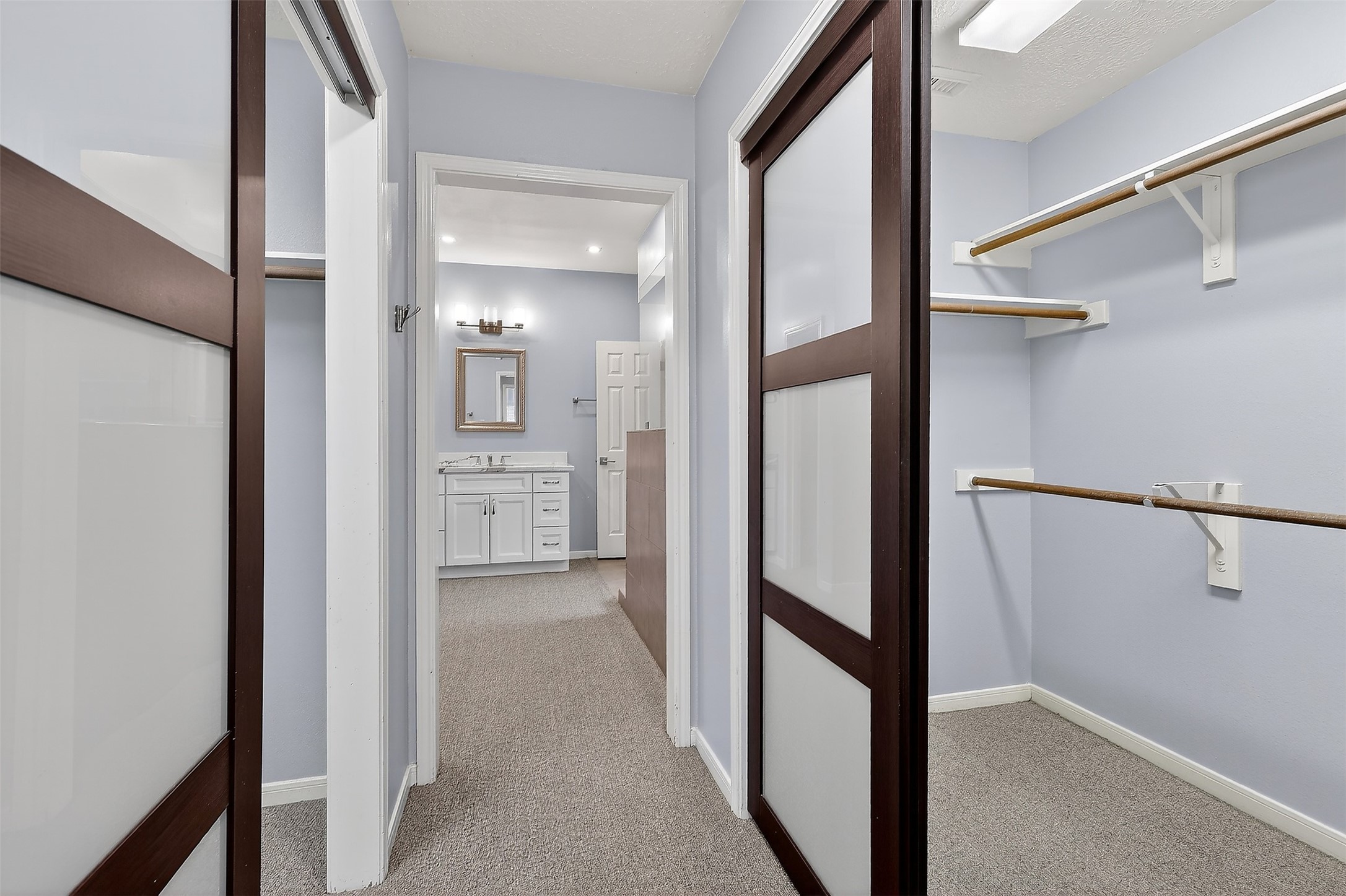 9319 Hudson Bend Circle Houston, TX 77095 - Photo 21 of 42 Entry to the ensuite bathroom and double walk-in closets