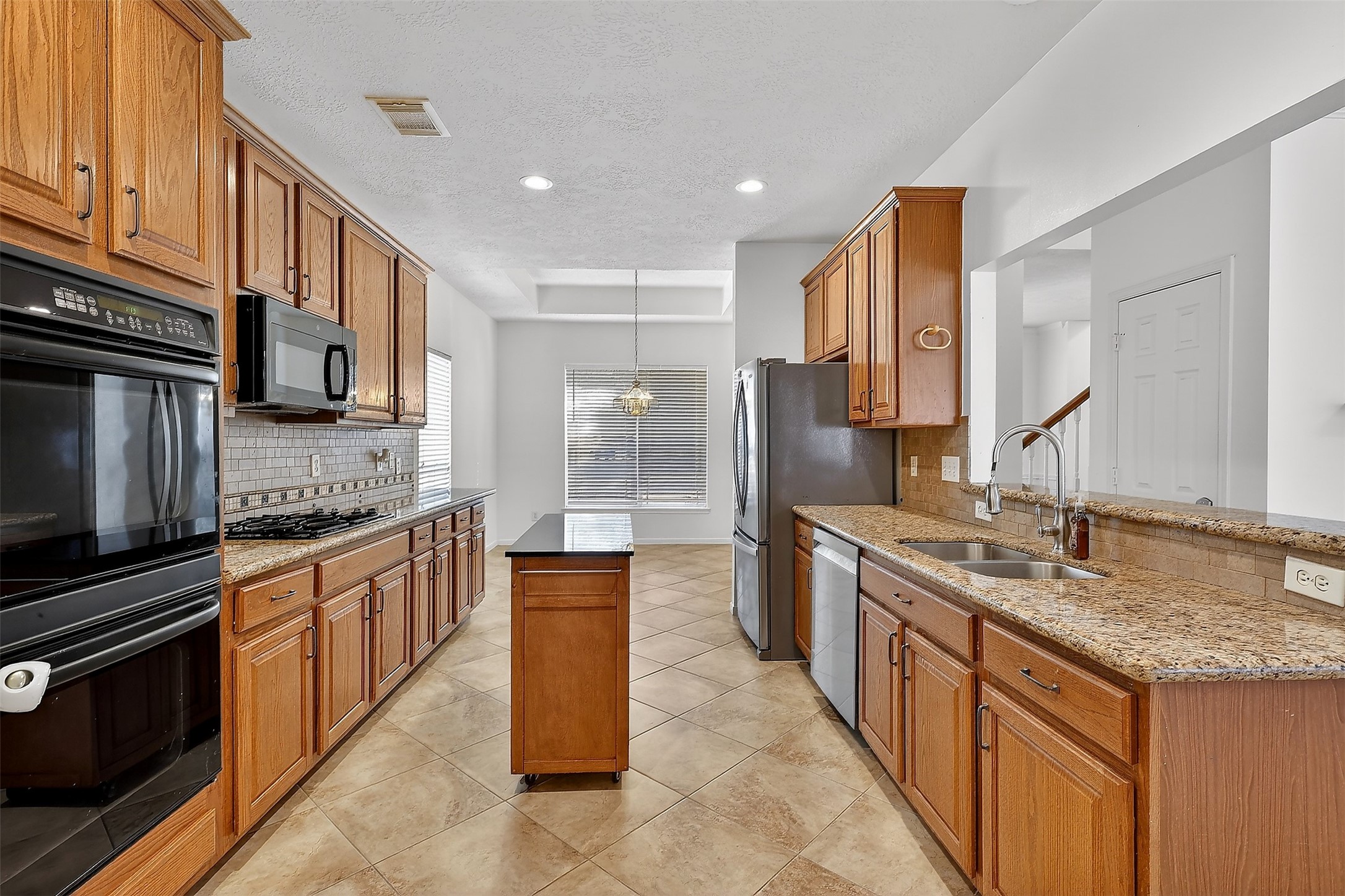 9319 Hudson Bend Circle Houston, TX 77095 - Photo 7 of 42 Kitchen with a movable island.