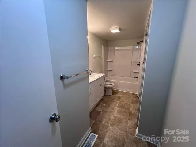 a bathroom with a sink and toilet