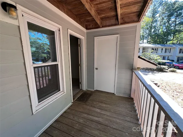 a view of a porch with wooden floor and outer view