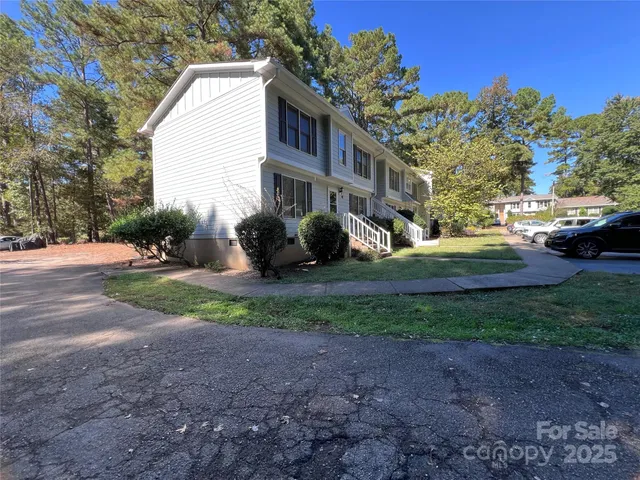 a view of a house with a backyard