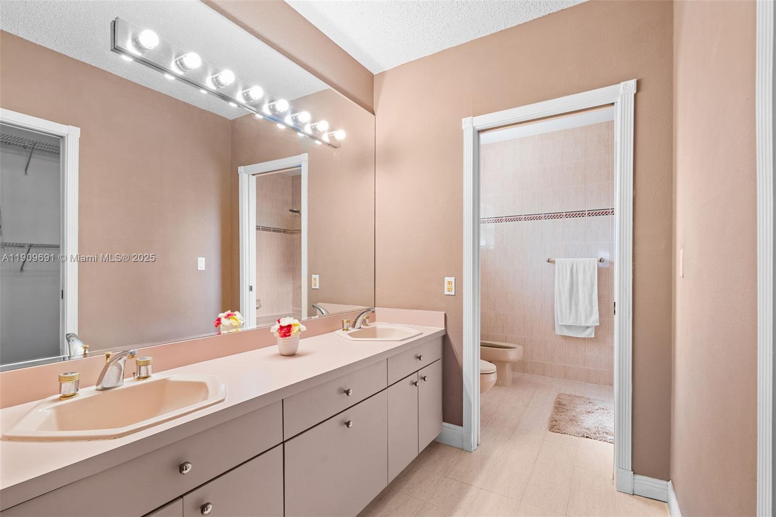 3510 Southwest 13th Street Miami, FL 33145 - Photo 14 of 30 a spacious en suite bathroom with double sink and a mirror