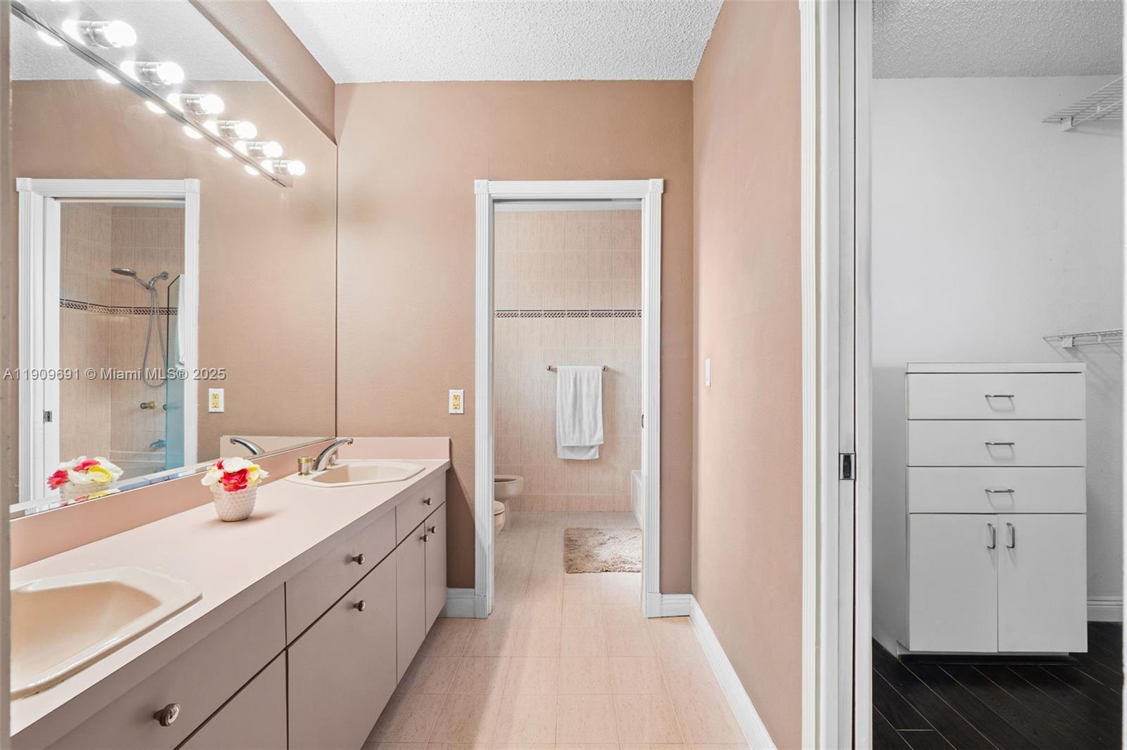 3510 Southwest 13th Street Miami, FL 33145 - Photo 15 of 30 a bathroom with a double vanity sink mirror and double