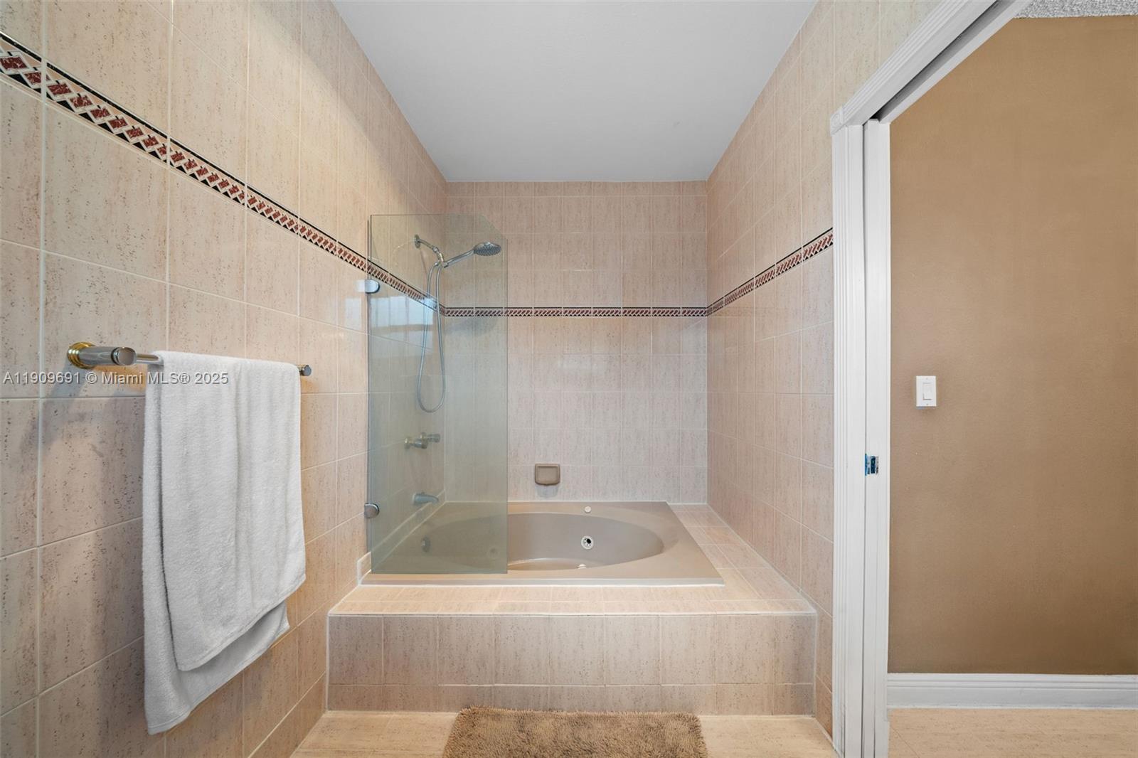 3510 Southwest 13th Street Miami, FL 33145 - Photo 16 of 30 a bathroom with a shower and a bath tub