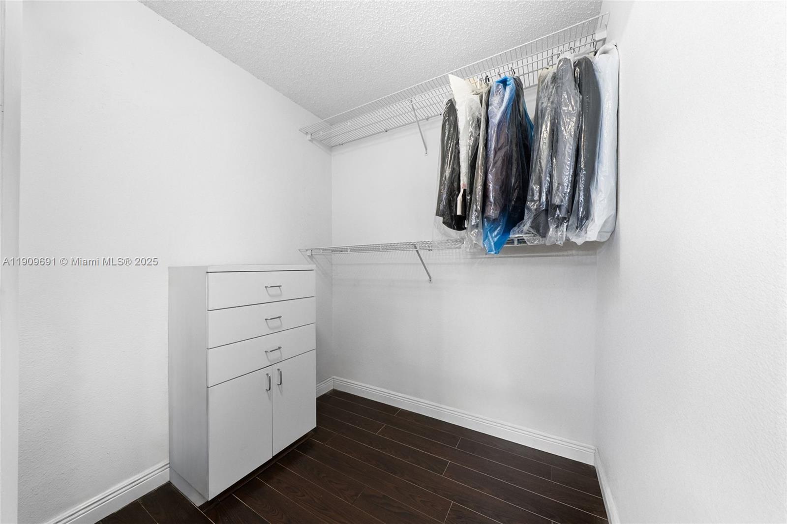 3510 Southwest 13th Street Miami, FL 33145 - Photo 17 of 30 a view of walk in closet with clothes