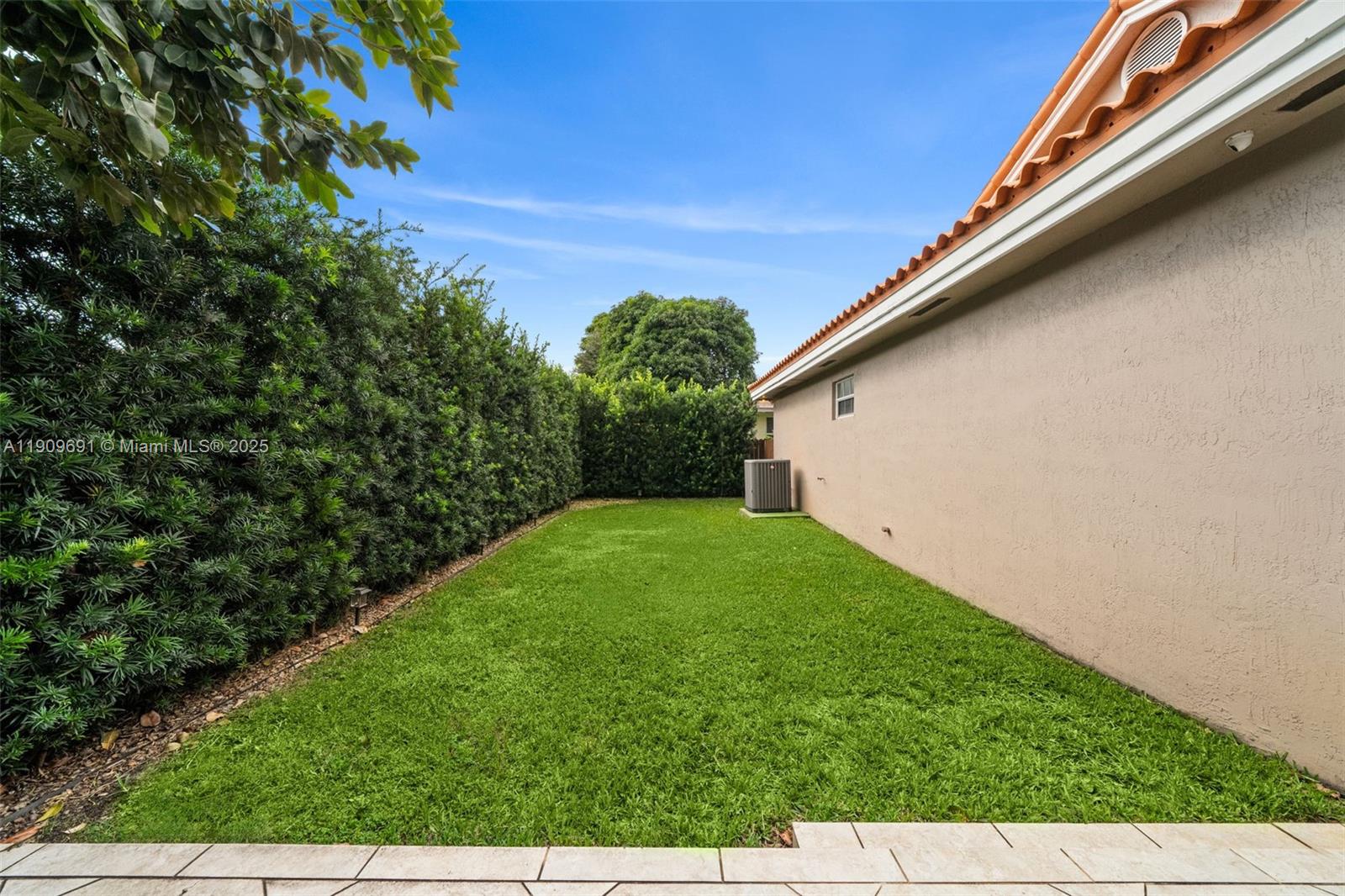 3510 Southwest 13th Street Miami, FL 33145 - Photo 26 of 30 a backyard of a house with lots of green space