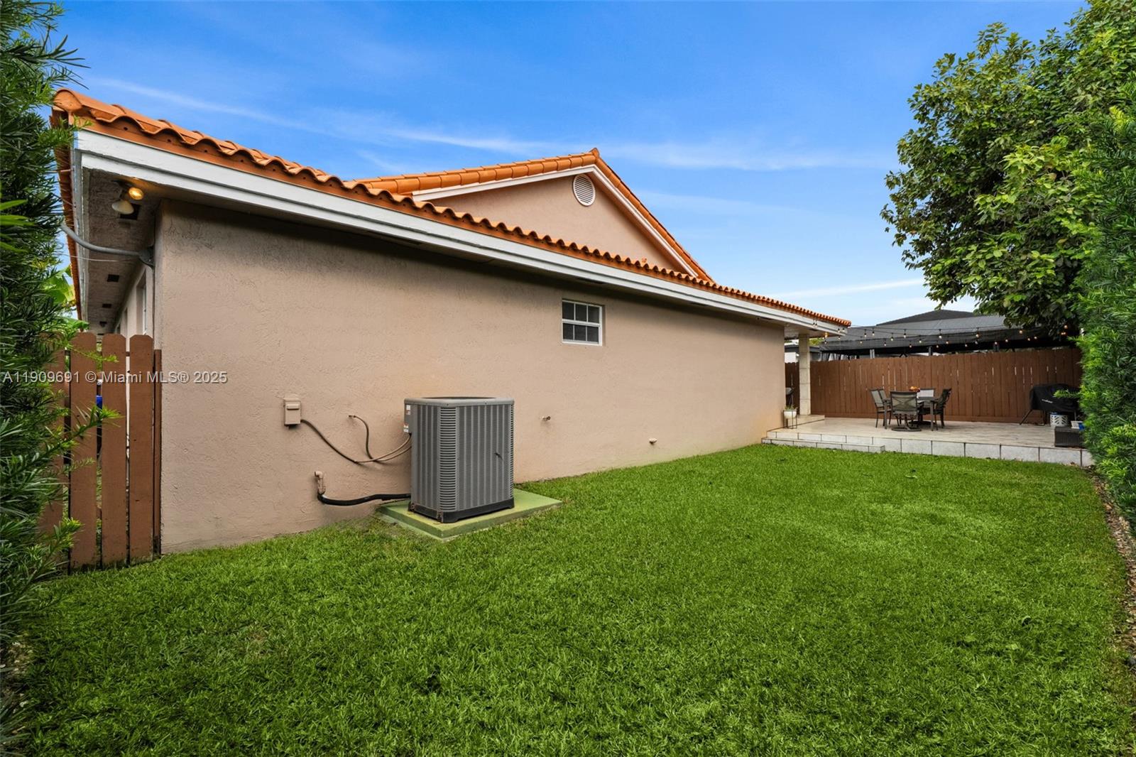 3510 Southwest 13th Street Miami, FL 33145 - Photo 27 of 30 a backyard of a house with lots of green space and outdoor seating