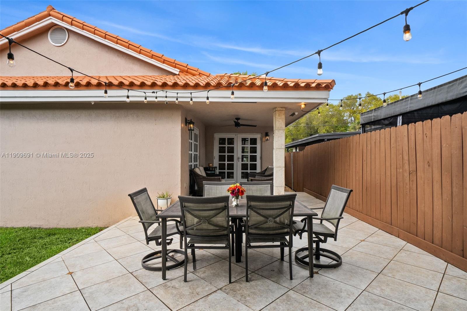 3510 Southwest 13th Street Miami, FL 33145 - Photo 29 of 30 a view of a patio with table and chairs and potted plants