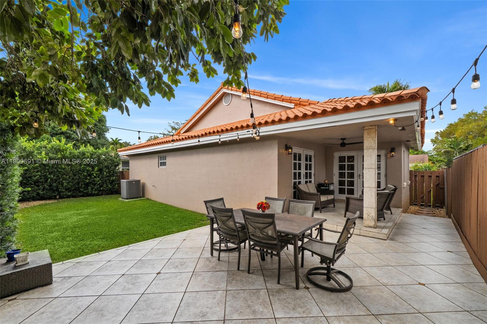 3510 Southwest 13th Street Miami, FL 33145 - Photo 30 of 30 a backyard of a house with table and chairs