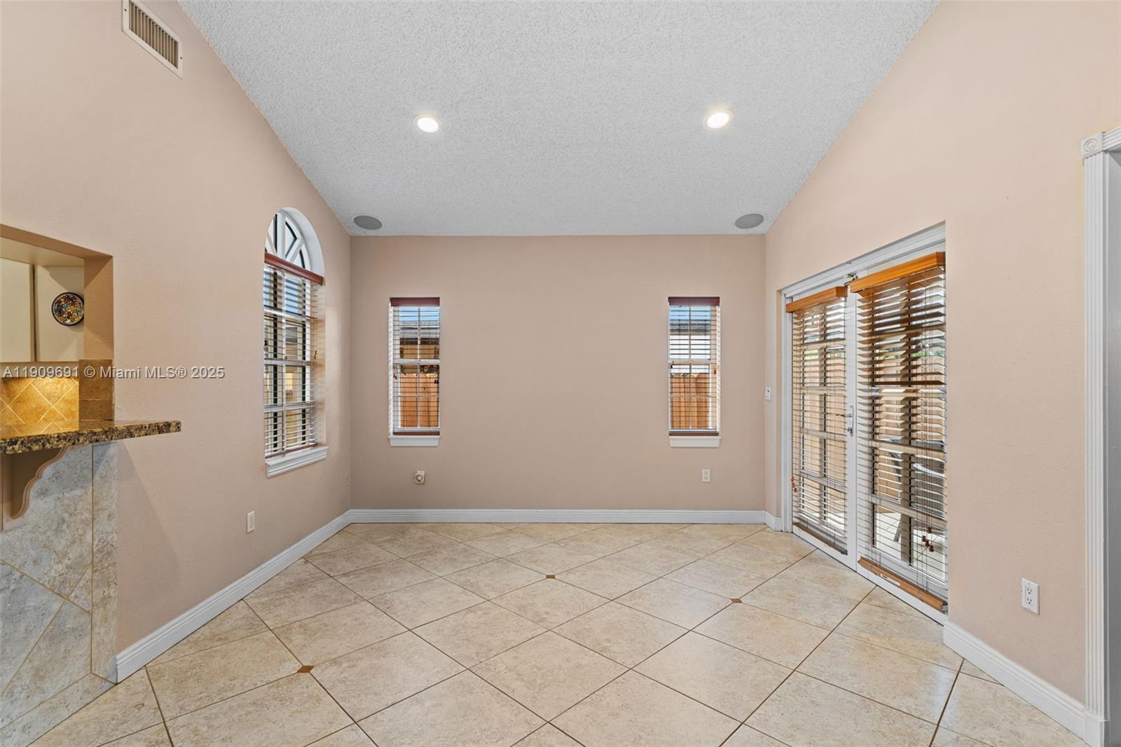 3510 Southwest 13th Street Miami, FL 33145 - Photo 9 of 30 a view of an empty room with a window