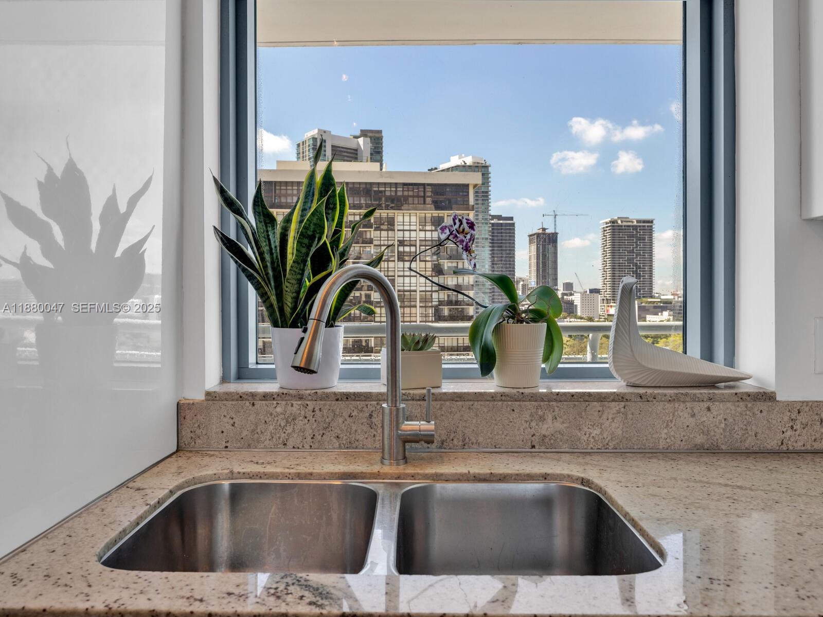 601 Northeast 36th Street, Unit 1304 Miami, FL 33137 - Photo 11 of 40 a close view of sink and faucet