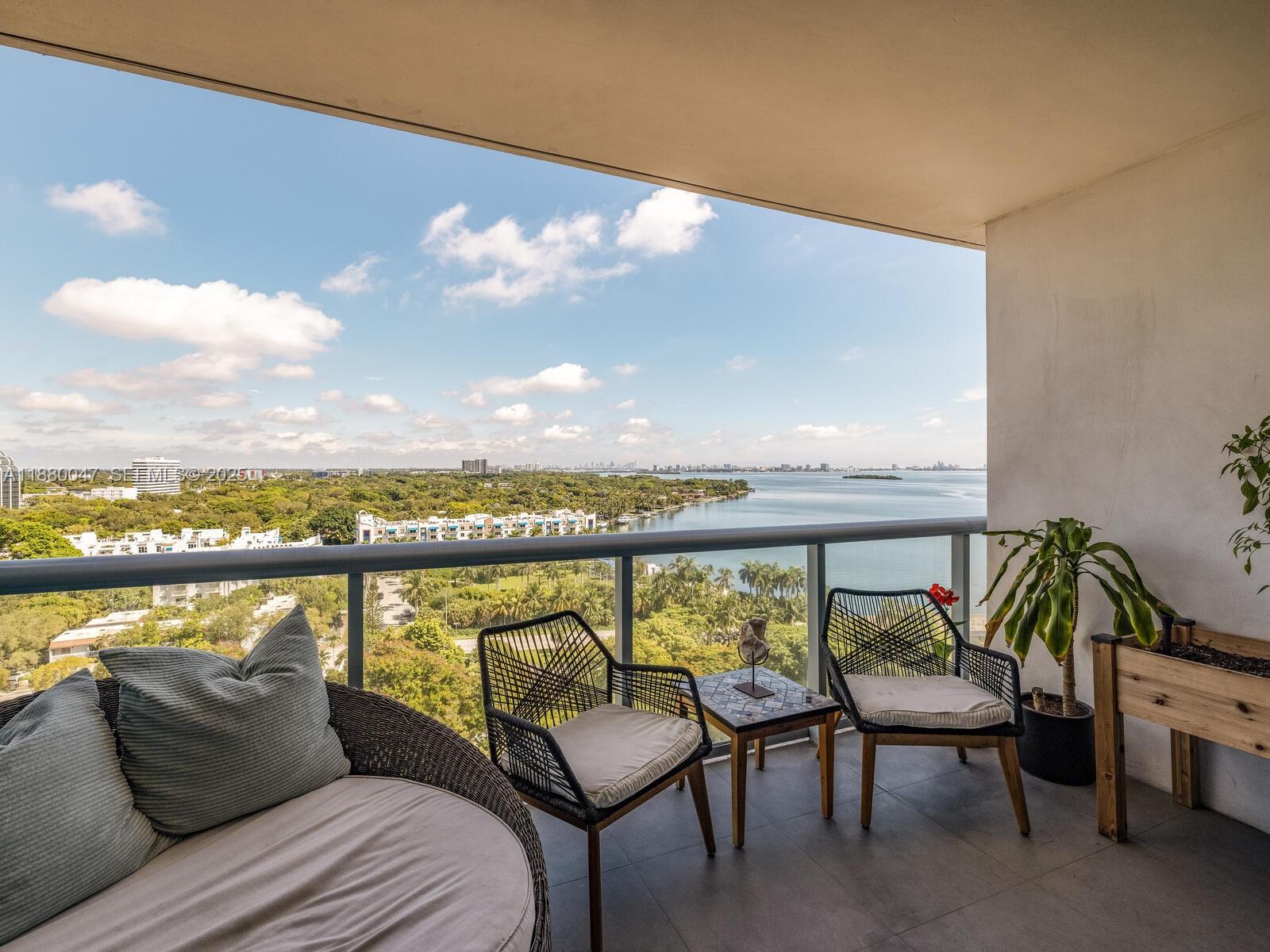 601 Northeast 36th Street, Unit 1304 Miami, FL 33137 - Photo 18 of 40 a balcony with chairs and city view