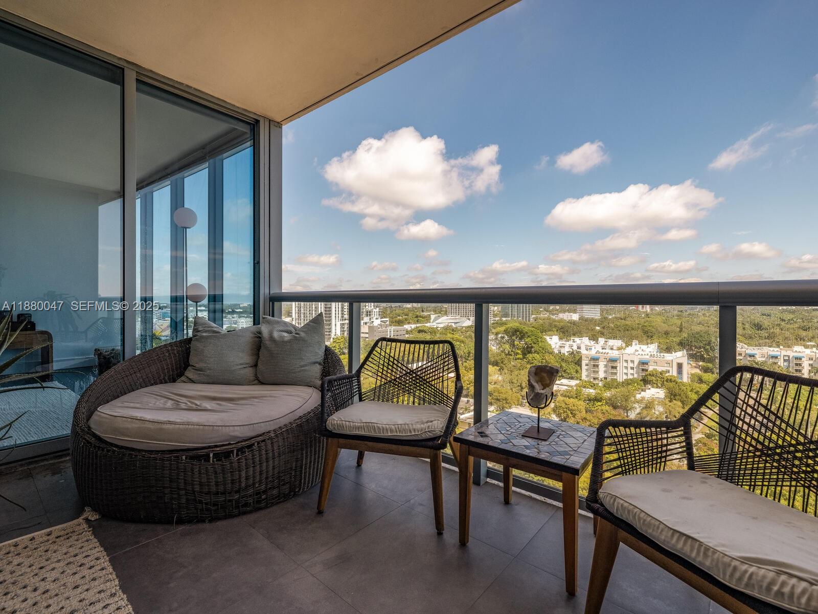 601 Northeast 36th Street, Unit 1304 Miami, FL 33137 - Photo 20 of 40 a living room with furniture and a large window