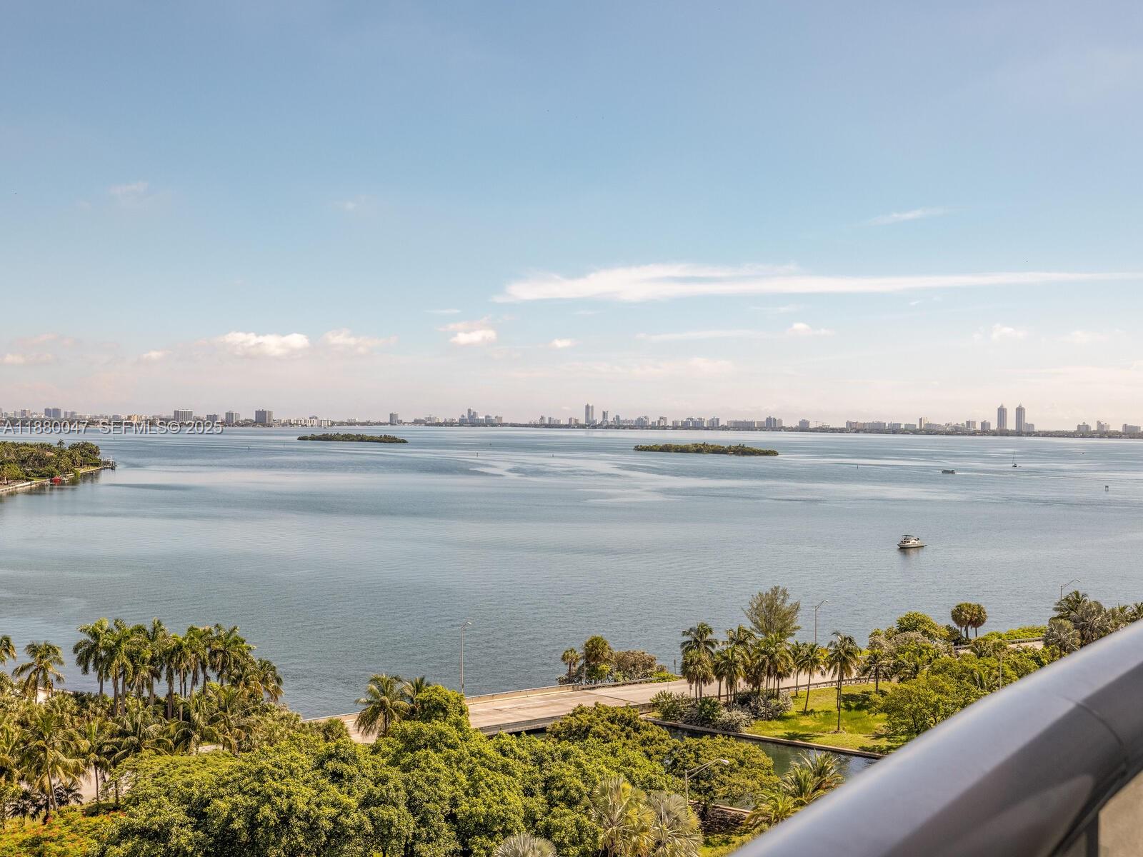 601 Northeast 36th Street, Unit 1304 Miami, FL 33137 - Photo 2 of 40 a view of a lake with a beach