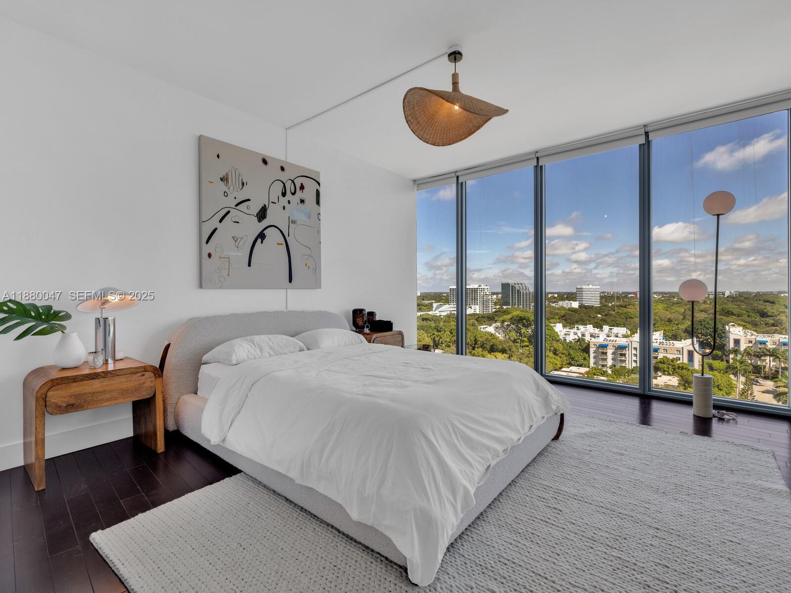 601 Northeast 36th Street, Unit 1304 Miami, FL 33137 - Photo 22 of 40 a bedroom with a bed and a large window