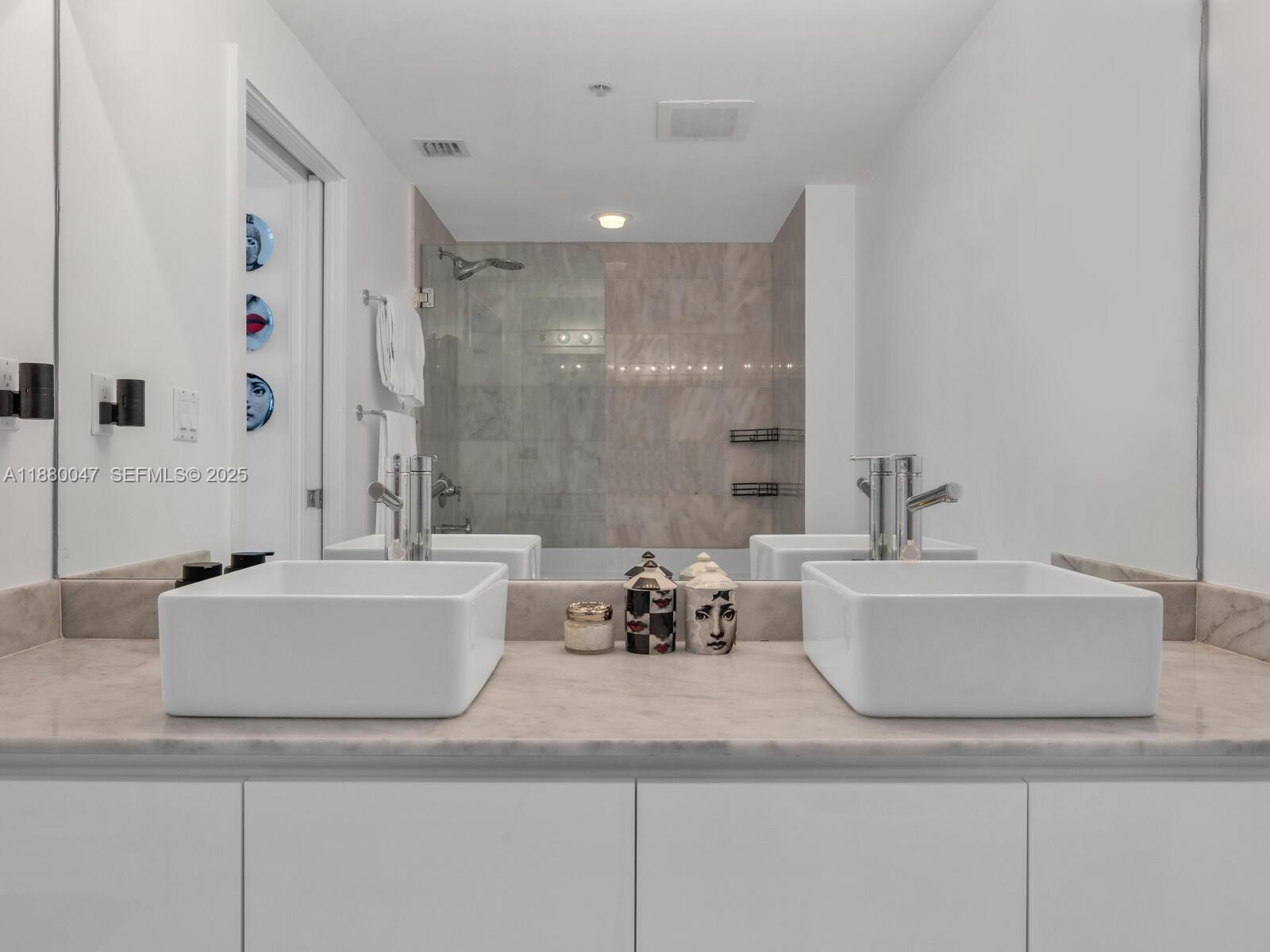 601 Northeast 36th Street, Unit 1304 Miami, FL 33137 - Photo 30 of 40 a white bath tub sitting next to a white sink