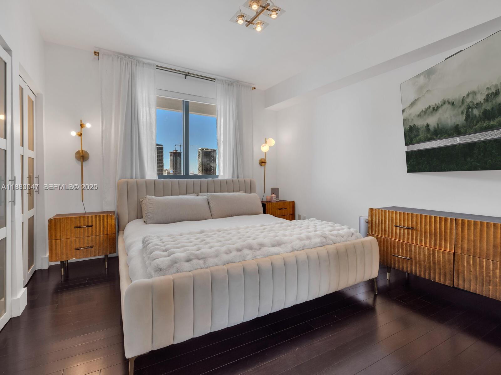 601 Northeast 36th Street, Unit 1304 Miami, FL 33137 - Photo 33 of 40 a bedroom with a bed and a couch