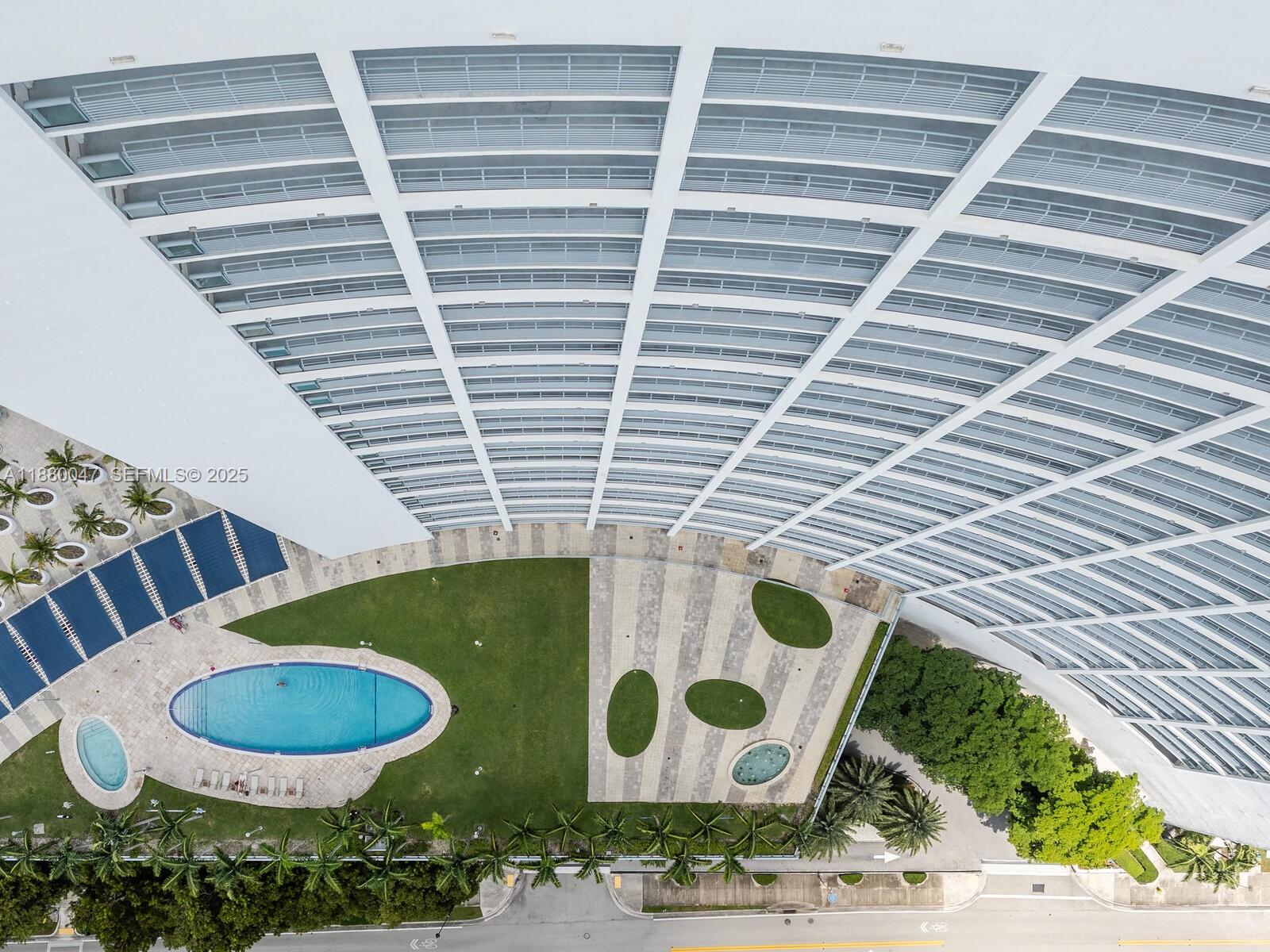 601 Northeast 36th Street, Unit 1304 Miami, FL 33137 - Photo 36 of 40 a bathroom with a granite countertop sink and mirror