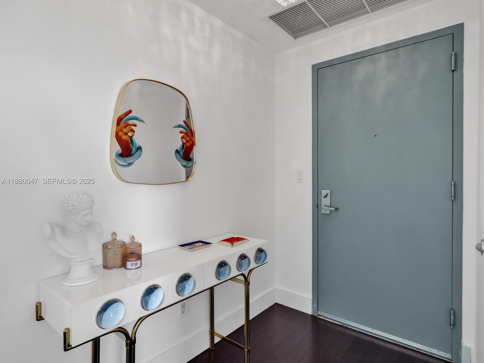 601 Northeast 36th Street, Unit 1304 Miami, FL 33137 - Photo 7 of 40 a dining room with furniture and wooden floor