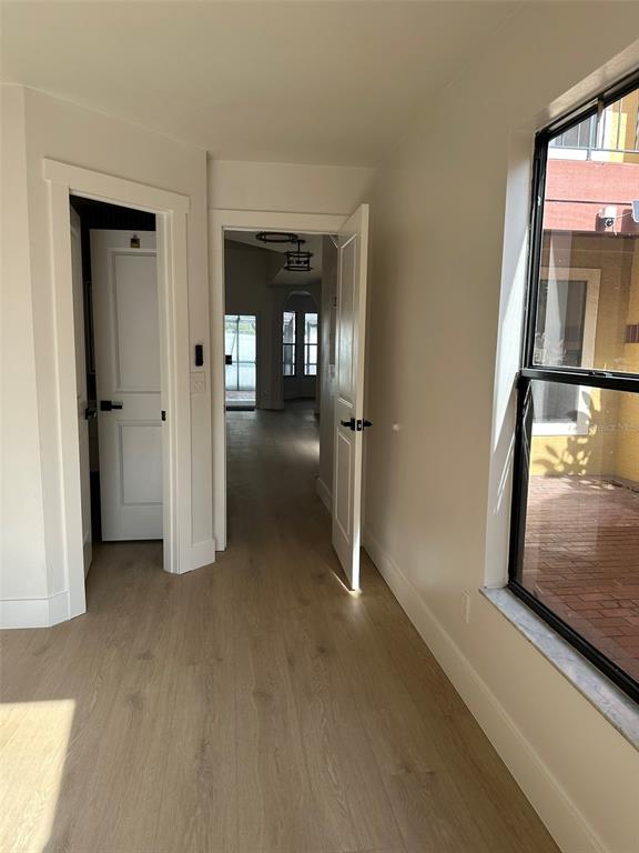 706 Lighthouse Court Altamonte Springs, FL 32714 - Photo 15 of 64 a view of a hallway with wooden shelves