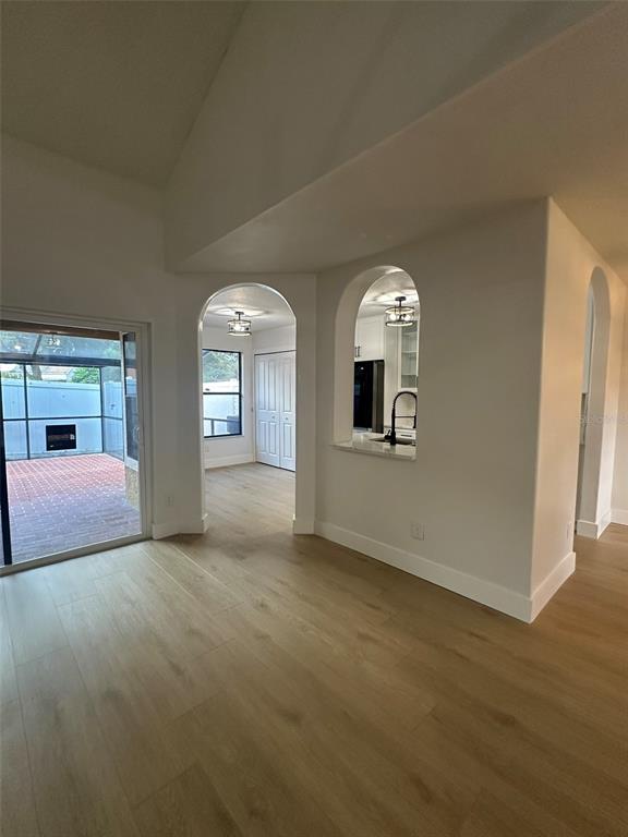 706 Lighthouse Court Altamonte Springs, FL 32714 - Photo 35 of 64 a big room with wooden floor chandelier and windows