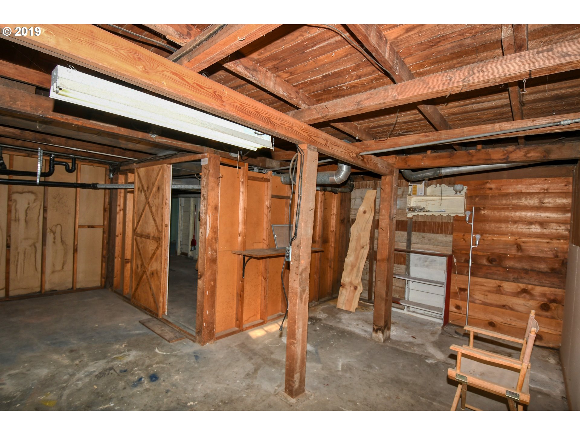 1008 Southwest Frazer Avenue Pendleton, OR 97801 - Photo 24 of 32 a view of an empty room with wooden walls