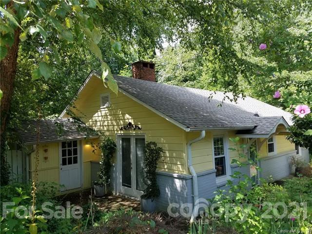 51 Doubleday Road Tryon, NC 28782 - Photo 1 of 1 a view of a house with a plants