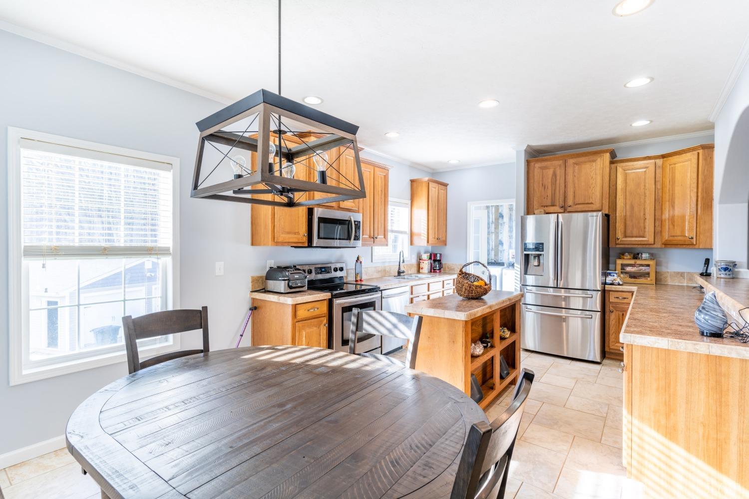2659 Chilton Road Appomattox, VA 24522 - Photo 12 of 55 a kitchen with a refrigerator and a stove top oven