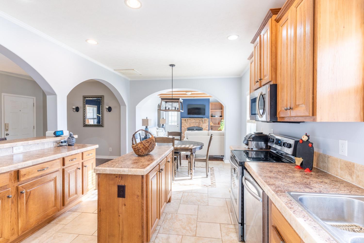 2659 Chilton Road Appomattox, VA 24522 - Photo 14 of 55 a kitchen with stainless steel appliances granite countertop a sink and a refrigerator