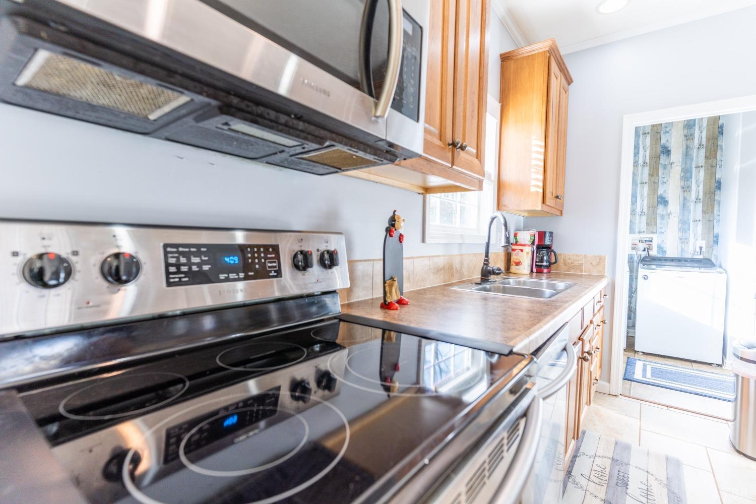 2659 Chilton Road Appomattox, VA 24522 - Photo 20 of 55 a kitchen with a stove and a sink