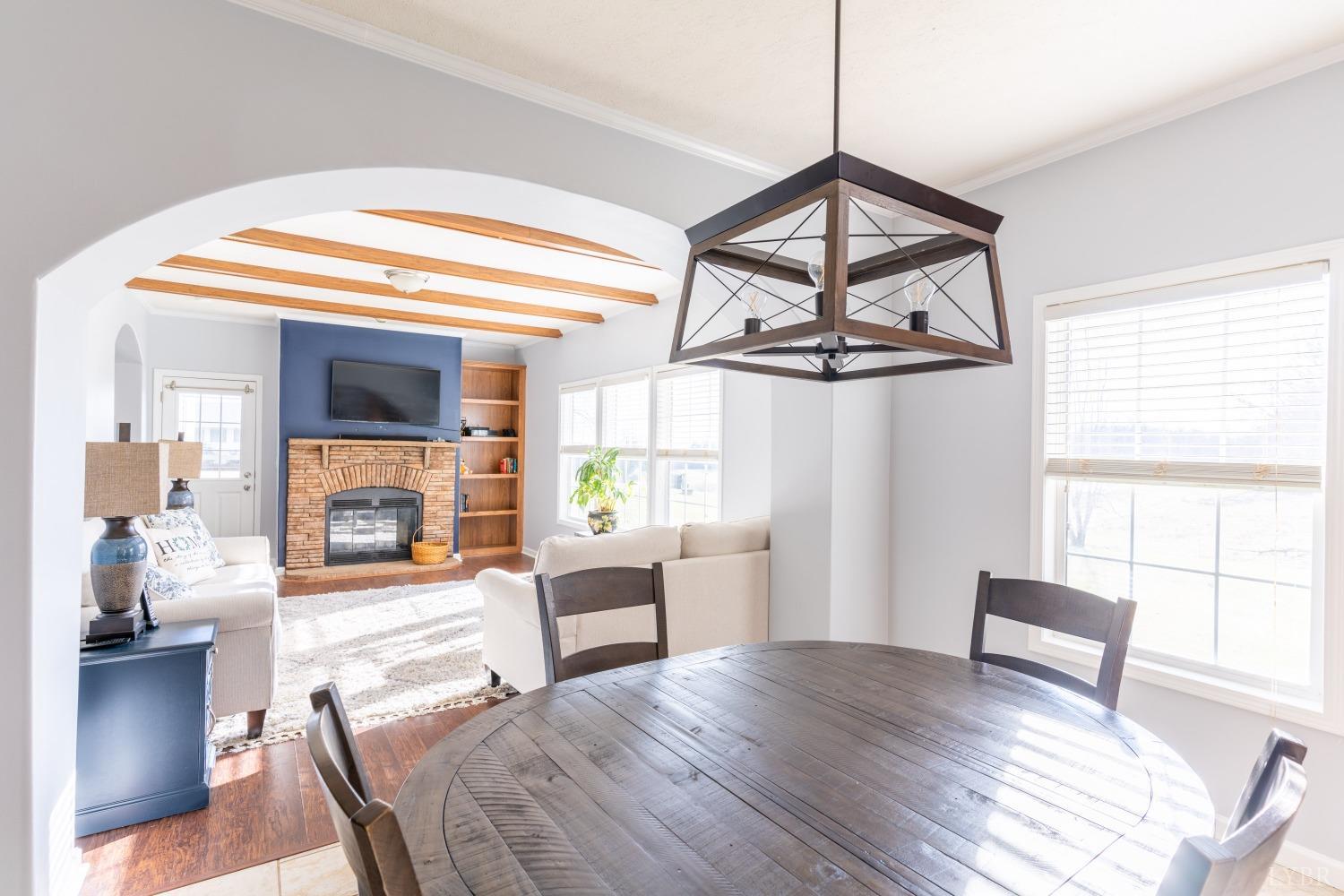 2659 Chilton Road Appomattox, VA 24522 - Photo 22 of 55 a view of a livingroom with furniture wooden floor and a chandelier