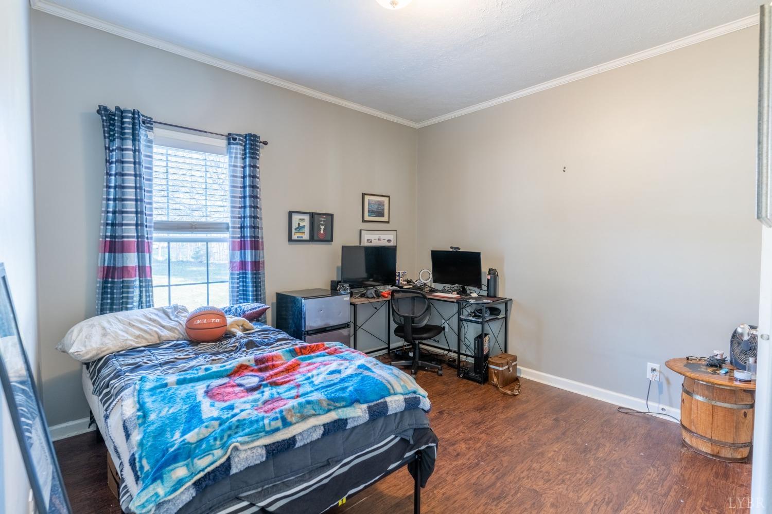 2659 Chilton Road Appomattox, VA 24522 - Photo 23 of 55 a bedroom with a bed and a desk in it