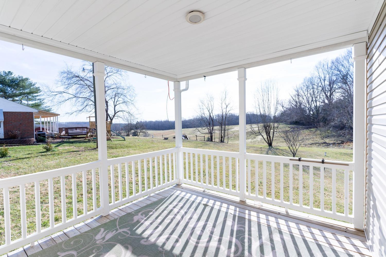 2659 Chilton Road Appomattox, VA 24522 - Photo 35 of 55 a view of a wooden deck next to a yard