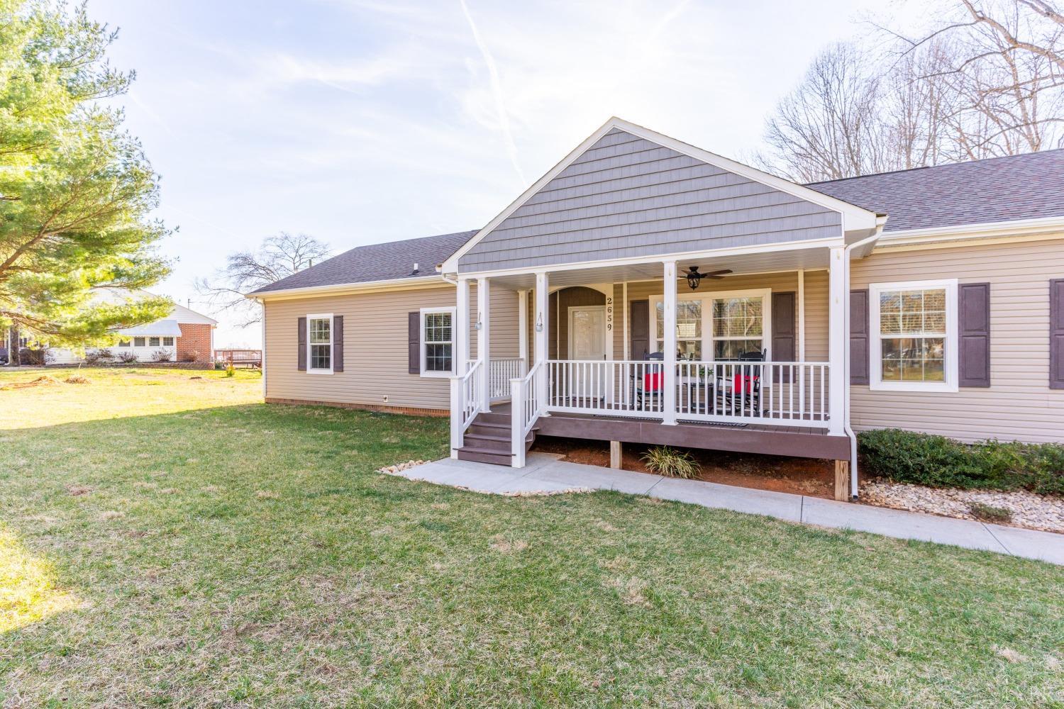 2659 Chilton Road Appomattox, VA 24522 - Photo 36 of 55 a view of a house with a backyard and wooden deck