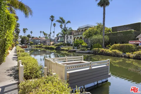 a view of a lake with a house in the background